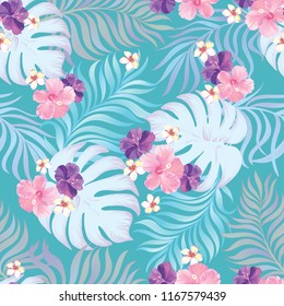 	
Tropical vector seamless background. Jungle pattern with flowers, monstera and palm leaves. Stock vector.