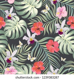 	
Tropical vector seamless background. Jungle pattern with flowers, monstera and palm leaves. Stock vector.