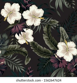 Tropical vintage dark, white hibiscus flower, palm leaves floral seamless pattern black background. Exotic jungle wallpaper.