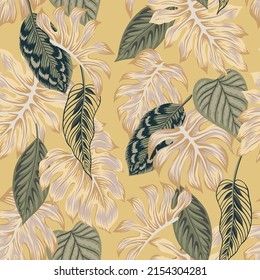 Tropical vintage exotic palm leaves floral seamless pattern yellow background. Botanical jungle wallpaper.