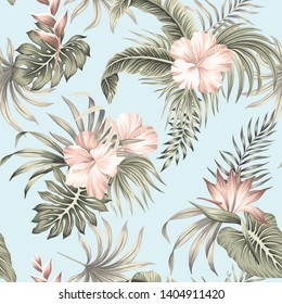 Tropical vintage hibiscus flower, palm leaves floral seamless pattern blue background. Exotic jungle wallpaper. 