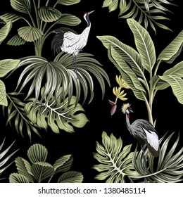 Tropical vintage night crane bird, palm trees, banana tree, palm leaves floral seamless pattern dark background. Exotic botanical jungle wallpaper.