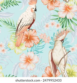 Tropical vintage palm leaves, pink hibiscus flower, pink cockatoo parrot floral seamless pattern blue background. Exotic jungle wallpaper.