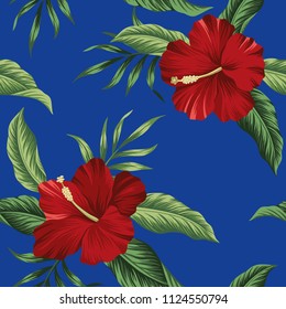 Tropical vintage red flower hibiscus floral green palm leaves seamless pattern blue background. Exotic jungle wallpaper.