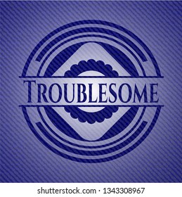 Troublesome emblem with jean background