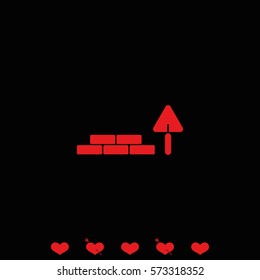 Trowel and brick icon.