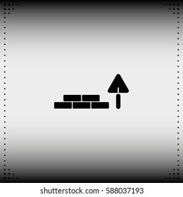 Trowel and brick icon.
