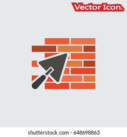 trowel and brick wall icon isolated sign symbol and flat style for app, web and digital design. Vector illustration.