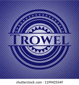 Trowel emblem with jean background