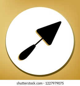 Trowel sign. Vector. Black icon with light brown shadow in white circle with shaped ring at golden background.