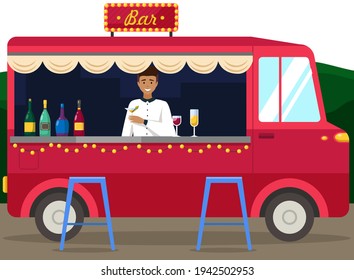 Truck with bartender making alcohol drink for young people. Men buying cocktails from outdoor bar