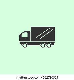 truck icon flat. Grey vector symbol on green background