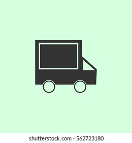 Truck icon flat. Grey vector symbol on green background