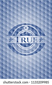 True blue emblem or badge with geometric pattern background.