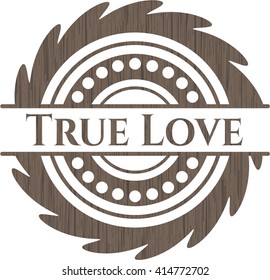 True Love badge with wood background