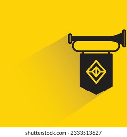 trumpet and banner with shadow on yellow background