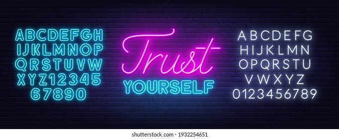 Trust yourself neon inspirational quote on a brick wall background.