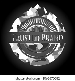   Trusted Brand on grey camouflage pattern