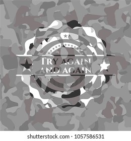 Try again and again written on a grey camouflage texture