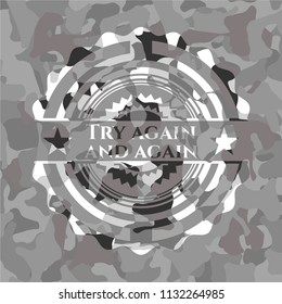 Try again and again written on a grey camouflage texture