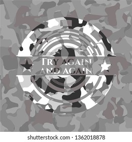 Try again and again written on a grey camouflage texture