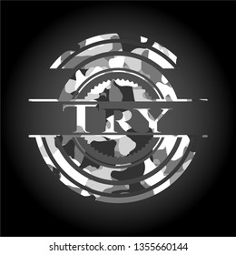 Try written on a grey camouflage texture