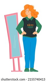 Trying on new clothes - modern flat design style character. Neat detailed image of beautiful redhead girl in front of a mirror. Jeans, vest and shirt. Modern fashion and urban outfit idea