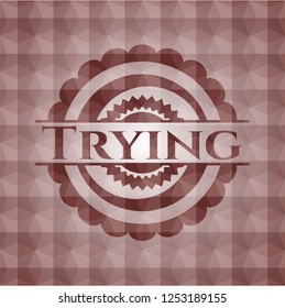 Trying red emblem or badge with abstract geometric polygonal pattern background. Seamless.