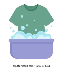 T-shirt in a basin with soapy water is washed by hands