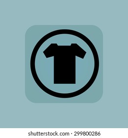 T-shirt in circle, in square, on pale blue background