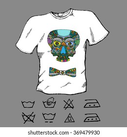 T-shirt design. Hand drawn white shirt with colorful skull and bowtie. Laundry care icons. Vector illustration svg