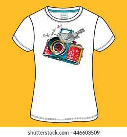 T-shirt design with image of a bright color camera and bird in the folk style. Vector illustration.