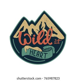 T-shirt print design. Vector badge illustration with lettering Wild at heart.