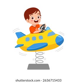 ttle boy playing on airplane spring rider at playground smiling broadly