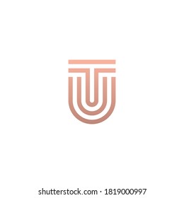 TU or UT monogram logo in gold color.