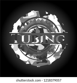 Tubing written on a grey camouflage texture