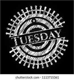  Tuesday chalkboard emblem written on a blackboard