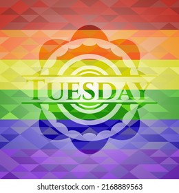 Tuesday emblem on mosaic background with the colors of the LGBT flag. 