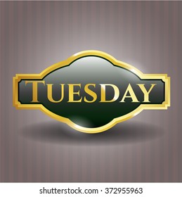 Tuesday golden emblem or badge