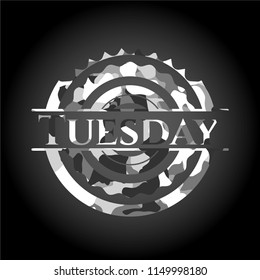 Tuesday on grey camouflage texture