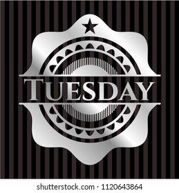 Tuesday silvery emblem or badge