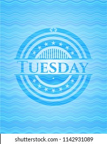 Tuesday water representation emblem.