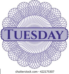 Tuesday written inside rosette