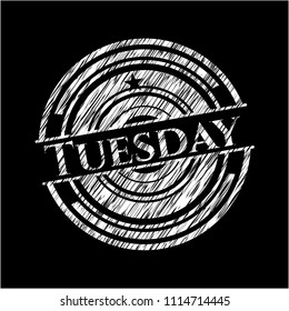 Tuesday written on a blackboard