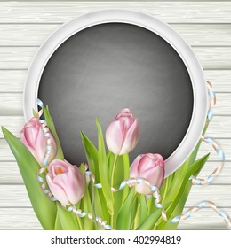 Tulips with chalkboard on wooden background. EPS 10 vector file included