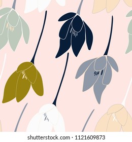 Tulips or crocuses vector seamless pattern. Floral modern background with stylized hand drawn flowers in pastel colors.
