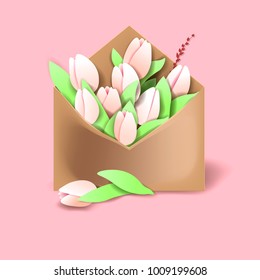 Tulips of pink color in the paper envelope with springs and one flower separately lying