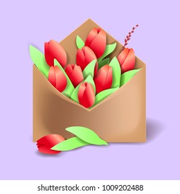 Tulips of red color in the paper envelope with springs and one flower separately lying