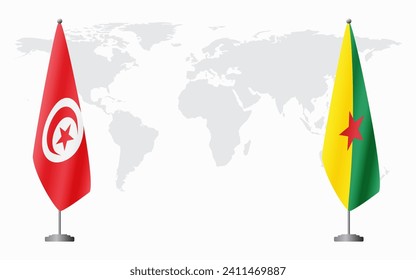 Tunisia and French Guiana flags for official meeting against background of world map.
