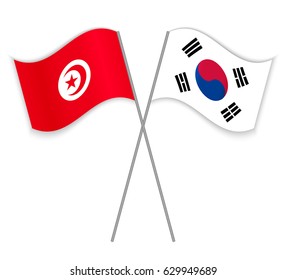 Tunisian and South Korean crossed flags. Tunisia combined with South Korea isolated on white. Language learning, international business or travel concept.